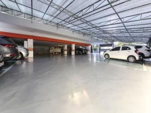 a parking garage with cars parked in it at Mora Stay in Busan +57 photos