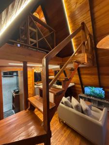 a living room with a loft bed and a couch at Nature Senses Chapadinha in Cavalcante +52 photos