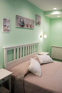 Un pat sau paturi într-o cameră la Arcadia Domus
