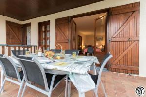 a dining room with a table and chairs at Farguettou in Nailloux