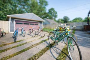 a group of bikes parked in front of a garage at Broad Ripple Getaway, Hot Tub, King Bed, Walk to Shops, Bike the Monon in Indianapolis