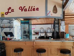 a restaurant with a la value sign above a counter at Chalet avec terrasse - 6 pers. - API-1-52-2030 in La Tour-dʼAuvergne +16 photos