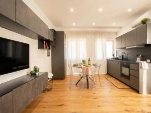 a kitchen with a table and a dining room at Sparano Mood 170 in Bari