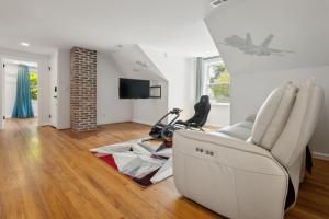 a living room with a couch and a chair at Tog Gun R&R I in Norfolk