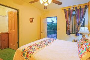 a bedroom with a large bed and a window at Beachside Bliss Suite 1 Block from Malecon in La Paz +5 photos