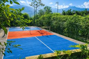 an outdoor basketball court with blue and orange at Thành An Homestay in Hòa Bình