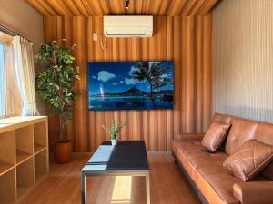a living room with a couch and a table at OZ Fuji in Fujiyoshida