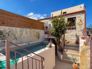 a swimming pool in the backyard of a house at Muses Mountain View in Ayía Varvára