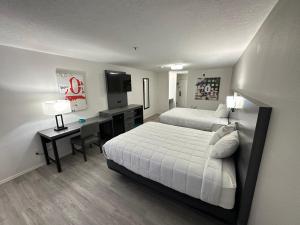 a hotel room with two beds and a desk at Quality Inn Carlin in Carlin +31 photos