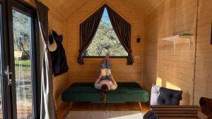 a person laying on a bed in a sauna at Intermezzo X by Tiny Away in Citta' Sant'Angelo +6 photos