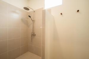 a shower with a glass door in a bathroom at SOL HOUSE kohlarn in Ko Larn +21 photos