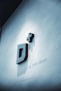 a jale group sign on the side of a building at JADE D Plus and E Plus Hakuba in Hakuba