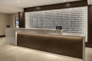 a lobby with a wall with writing on it at Doubletree By Hilton Lubbock - University Area in Lubbock +38 photos