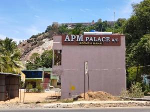 an apm palace mg sign on the side of a building at APM Palace in Palaiya Ayakkudi