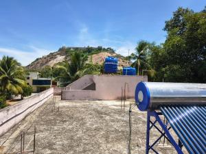 a skate park with a skateboard ramp in front of a mountain at APM Palace in Palaiya Ayakkudi