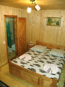 Säng eller sängar i ett rum på Sadyba Vasha Hata