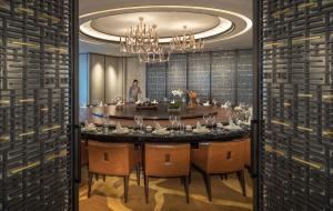 a dining room with a large table and chairs at Jumeirah Nanjing in Nanjing +68 photos
