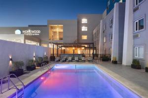 a swimming pool in front of a building at Tru by Hilton Saltillo in Saltillo