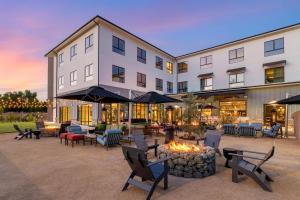 a hotel with a fire pit in the courtyard at Cambria Hotel Templeton - Paso Robles in Templeton