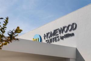 a sign on the side of a housewood suites building at Homewood Suites By Hilton Saltillo in Saltillo