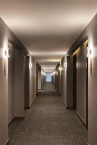 an empty corridor in a building with a hallway at Homewood Suites By Hilton Saltillo in Saltillo +77 photos