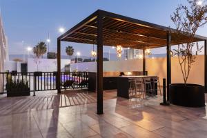 a gazebo with a bar on a patio at Homewood Suites By Hilton Saltillo in Saltillo