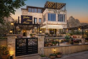 a building with a entrance to a flower show house at Yellow Stone House in Göreme