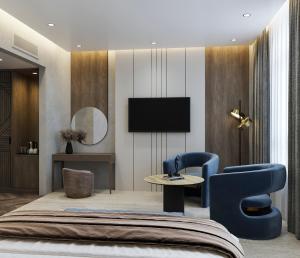 a hotel room with a bed and a tv at Donatello Premium Almaty in Almaty +21 photos