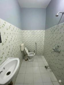 a bathroom with a toilet and a sink at Hotel Rudra Ganga View Near Temple in Varanasi +62 photos
