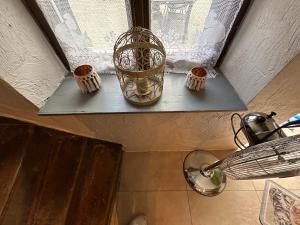 a window sill with three small candles on it at Chez Germaine in Bouillon +19 photos