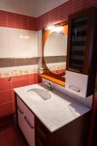 a bathroom with a sink and a mirror at Anthemia Luxurious Villa in Iraklitsa +37 photos