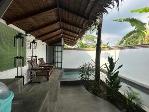 a house with a view of the water at Mias Home in Sunggal