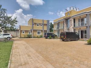 a parking lot in front of a building at Cosy Homes in Gulu