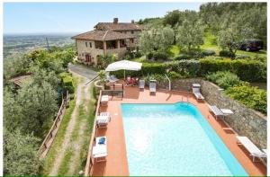 an aerial view of a house with a swimming pool at Villa Rachele in Larciano