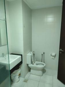 a white bathroom with a toilet and a sink at Trefoil Studio Unit Near Setia City Mall 1-5 Pax in Shah Alam +39 photos