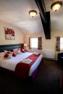 Postel nebo postele na pokoji v ubytování Ty Dre Town House