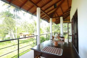 Balkón nebo terasa v ubytování River Breeze Villa Bentota
