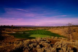 a view of a golf course with a green at Brasada Ranch in Powell Butte