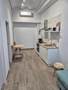 a kitchen with a sink and a table in a room at Pinedo Playa Holiday 2 in Valencia