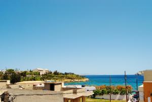 a view of the ocean from a building at Apollonia Apartments in Agia Pelagia