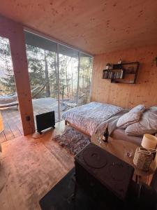 Llit o llits en una habitació de Tinyhouse Veranda