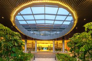 a large building with a large glass ceiling at Swiss-Grand Beach Resort Kuantan - Newly Upgraded 5-Star in Kuantan
