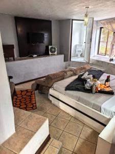 a bedroom with a large bed and a couch at Ui Views in Margate