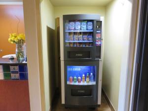 a refrigerator that has some drinks in it at La Hacienda Inn in San Antonio