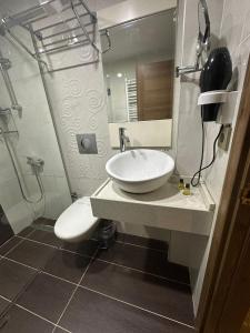 a bathroom with a sink and a mirror at Rain Golden Hotel in Istanbul +18 photos