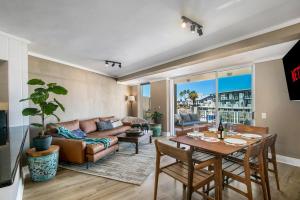 a living room with a couch and a table at Knysna Waterfront, Stunning Views in Knysna