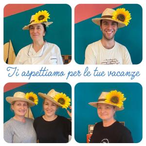 a man and a woman wearing a sunflower hat at Hotel St. Moritz in Rimini