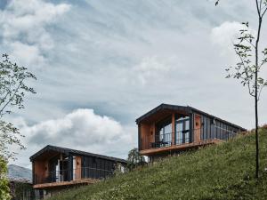 a house on top of a hill at Phoenix Relax Park in Bukovel