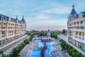a view of a resort with a river between two buildings at Haydarpasha Palace Hotel in Avsallar