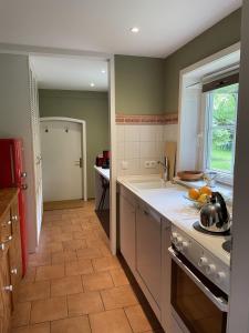 a kitchen with a sink and a counter top at Heidenest in Soltau